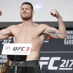 Bisping poses at UFC 217 weigh-ins.