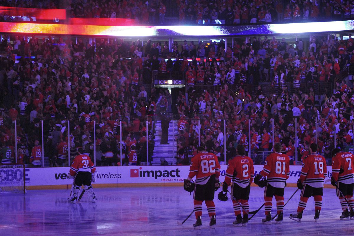 The Blackhawks stand at the blue line during the national anthem before Game 5 of the 2010 Stanley Cup Final at the United Center.