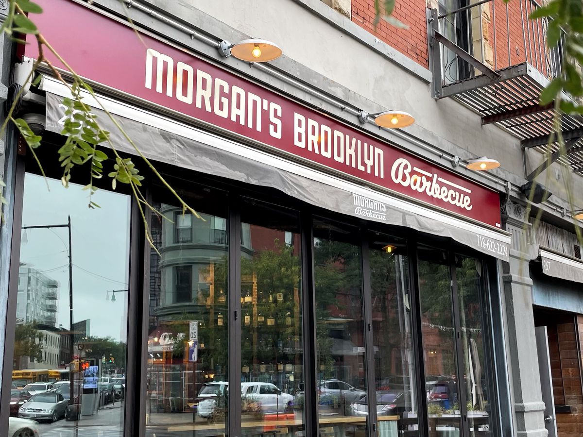 A barbecue restaurant’s red awning reads “Morgan’s Brooklyn Barbecue.”
