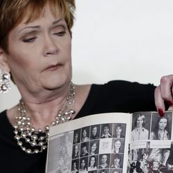 Beverly Young Nelson, the latest accuser of Alabama Republican Roy Moore, points to her photo in her high school yearbook during a news conference in New York, Monday, Nov. 13, 2017. Nelson says Moore assaulted her when she was 16 and he offered her a ride home from a restaurant where she worked.
