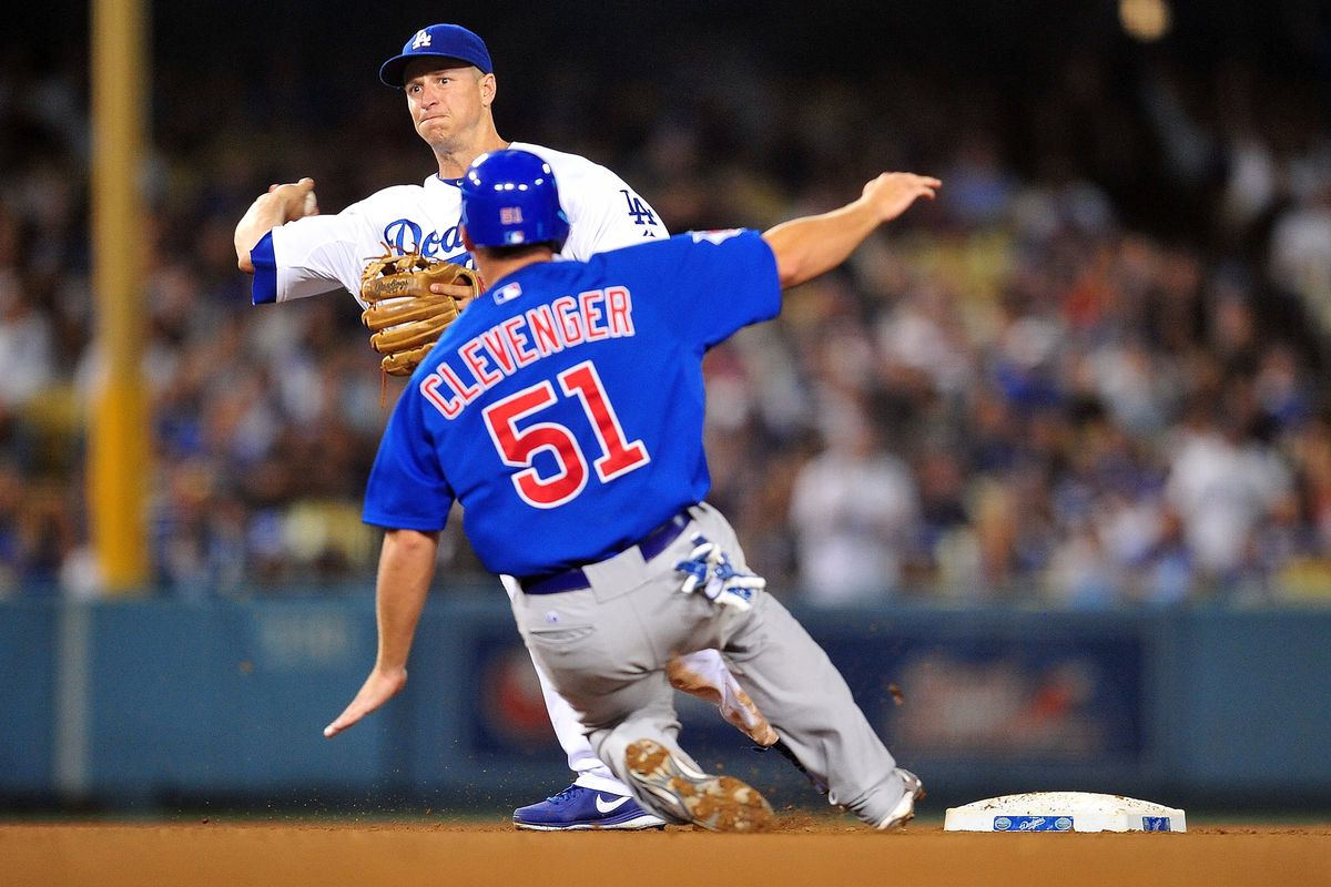 Los Angeles, CA, USA; Los Angeles Dodgers second baseman Mark Ellis throws to first to turn a double play against the Chicago Cubs at Dodger Stadium. Credit: Gary A. Vasquez-US PRESSWIRE