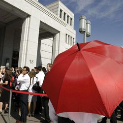 Attendees wait in line on outside the Conference Center during LDS Church Conference in Salt Lake City  Saturday, Oct. 1, 2011. 