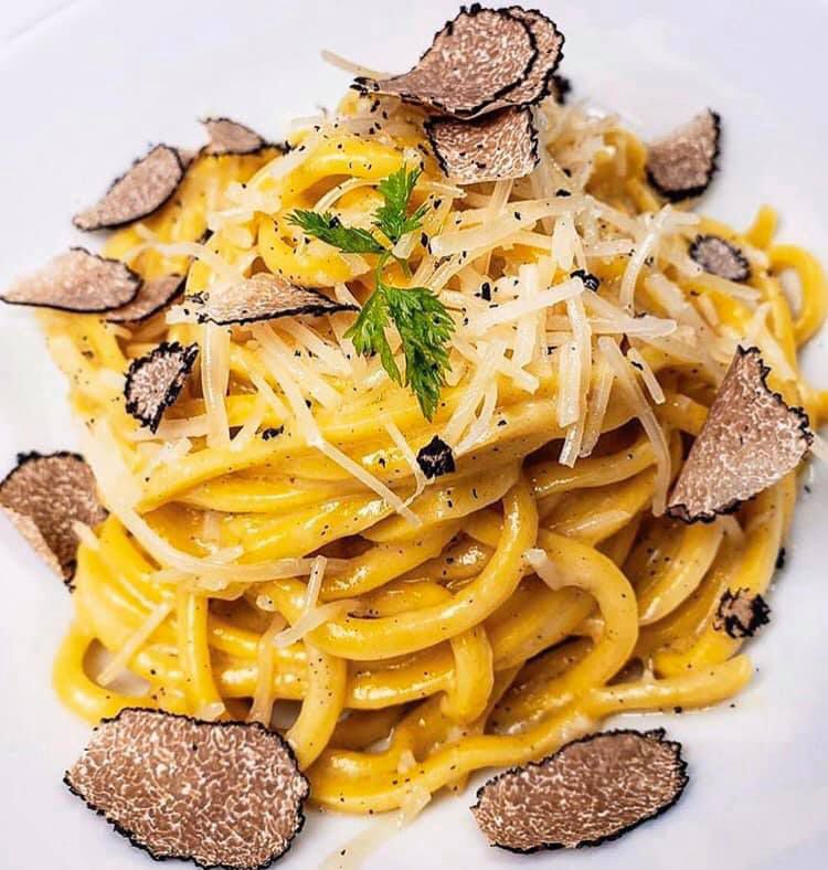 Potente’s spaghetti with shaved black truffles and dusted with shredded parmesan.
