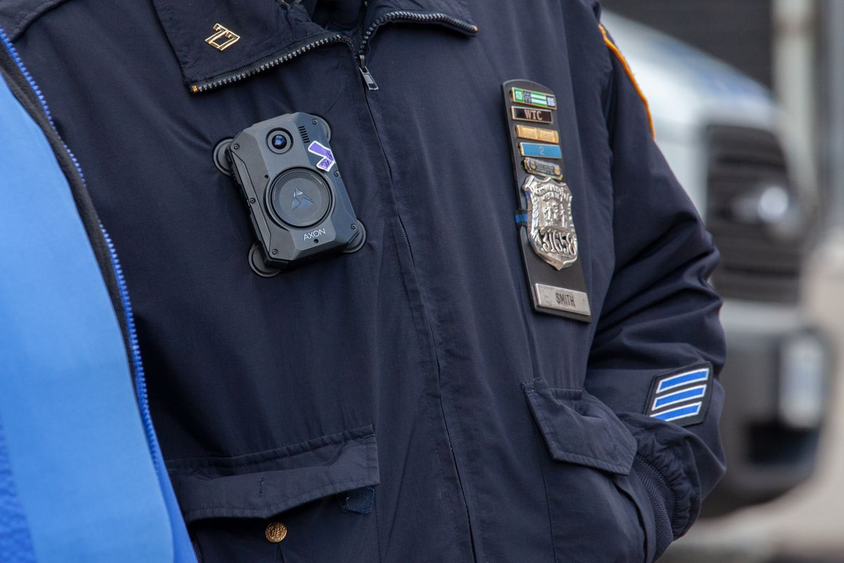 An NYPD officer wears a body camera while keeping watch on a protest in Crown Heights, Brooklyn, Jan. 20, 2021.