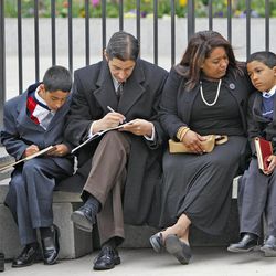 The Fernando Cruz family enjoys listening to conference outside during The Church of Jesus Christ of Latter-day Saints' Saturday afternoon session of the 183rd Annual General Conference Saturday, April 6, 2013, in Salt Lake City.