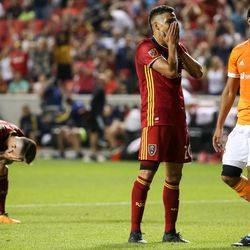 Real Salt Lake midfielder Albert Rusnak (11) and Real Salt Lake midfielder Luis Silva (20) react after Silva missed a shot in added time in a match against the Houston Dynamo at Rio Tinto Stadium in Sandy on Saturday, Aug. 5, 2017.