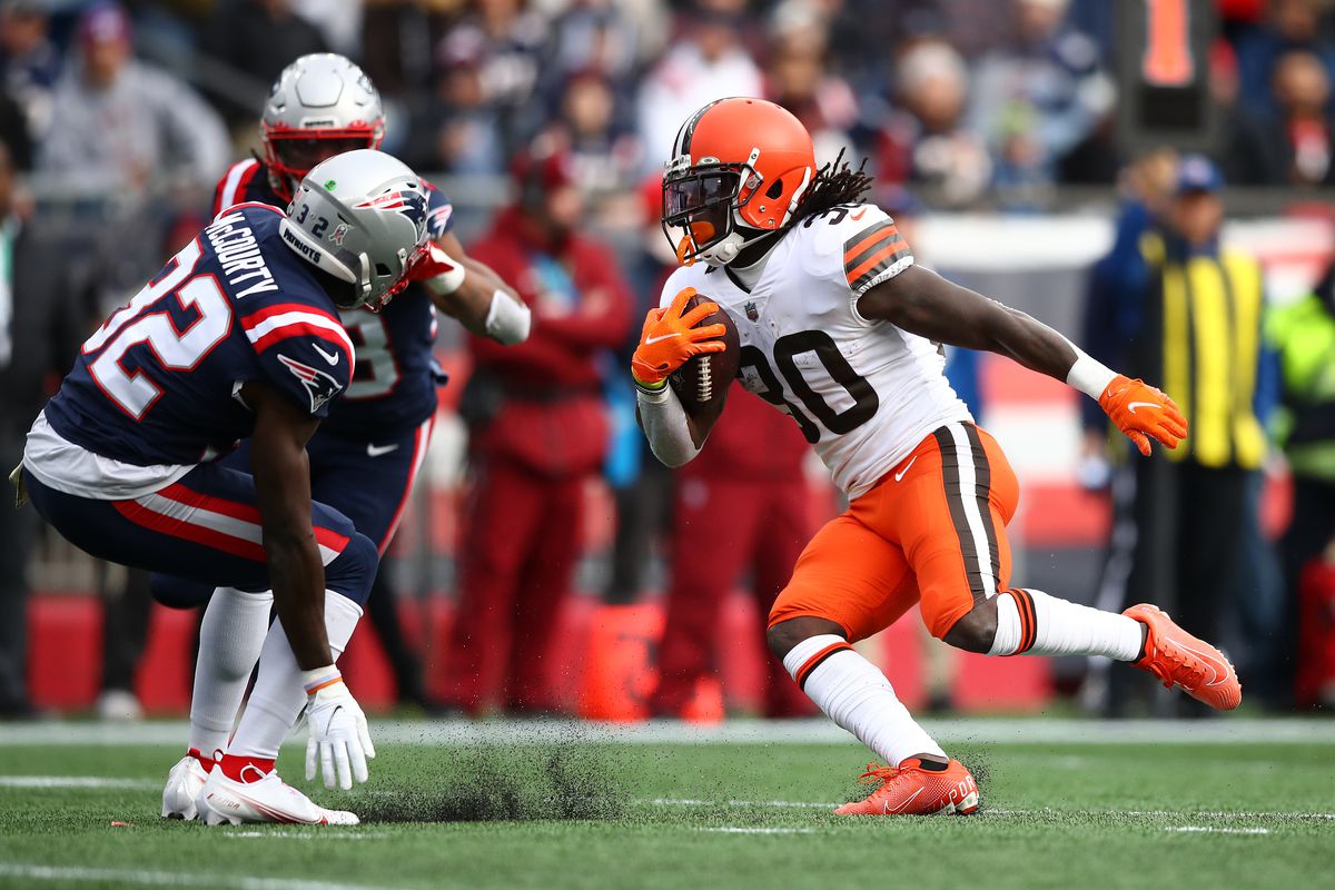 D’Ernest Johnson #30 of the Cleveland Browns carries the ball against Devin McCourty #32 of the New England Patriots during the first quarter at Gillette Stadium on November 14, 2021 in Foxborough, Massachusetts.