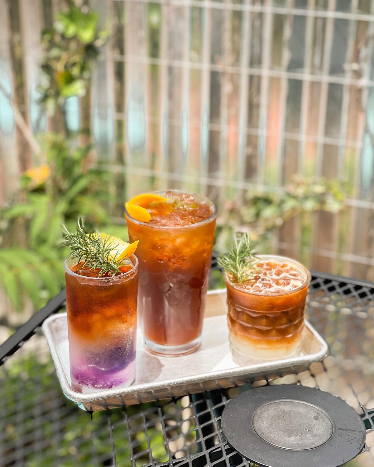 Three cold brew drinks from Velo Coffee in Chattanooga: Channel Orange; Garden Party with yuzu and butterfly pea tea; and rosemary lime espresso. 