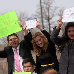 From left, Miguel Banuelos, Urani Martinez, Miriam Lazaro and Diana Estrada look for tickets between sessions of the 183rd Annual General Conference of The Church of Jesus Christ of Latter-day Saints outside the Conference Center in Salt Lake City on Sunday, April 7, 2013.