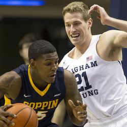 Brigham Young forward Kyle Davis (21) defends Coppin State forward Blake Simpson (15) during an NCAA college basketball game in Provo on Thursday, Nov. 17, 2016.