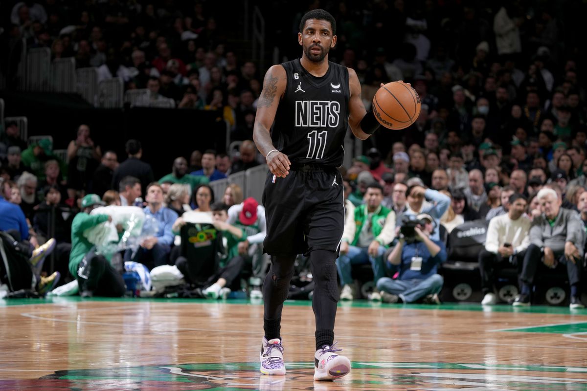 Kyrie Irving #11 of the Brooklyn Nets moves the ball during the game against the Boston Celtics on February 1, 2023 at the TD Garden in Boston, Massachusetts.