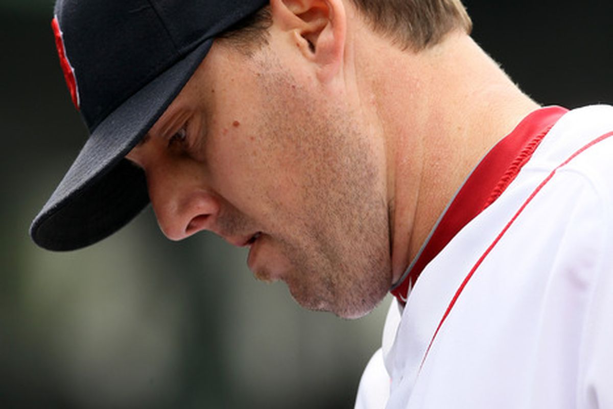 BOSTON, MA - MAY 05:  John Lackey #41 of the Boston Red Sox walks into the dugout after he was pulled from the game against the Los Angeles Angels on May 5, 2011 at Fenway Park in Boston, Massachusetts.  (Photo by Elsa/Getty Images)