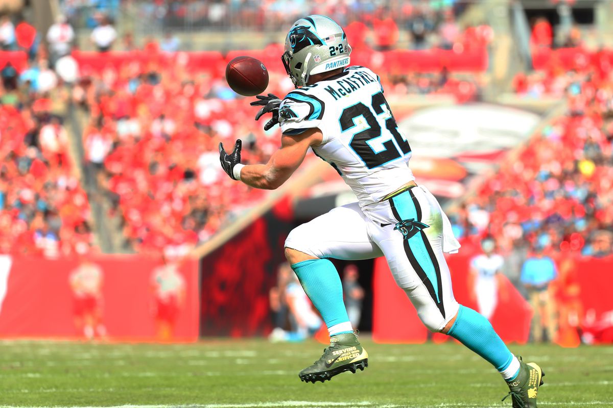 TAMPA, FLORIDA - DECEMBER 02: Christian McCaffrey #22 of the Carolina Panthers catches an eight-yard touchdown pass and run from Cam Newton (not pictured) during the first quarter against the Tampa Bay Buccaneers at Raymond James Stadium on December 02, 2