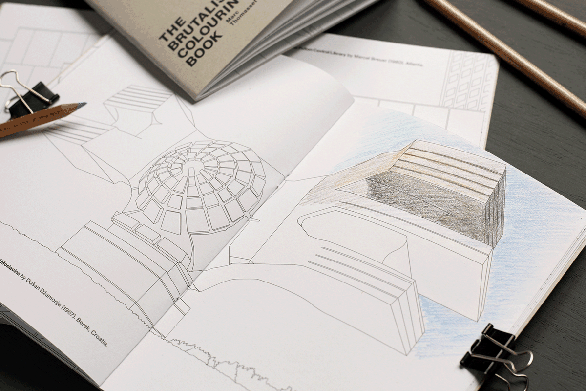Shot of a coloring book with line drawings of Brutalist buildings. 
