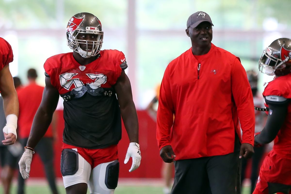 Noah Spence (56) and Defensive Coordinator Todd Bowles during the Tampa Bay Buccaneers Training Camp on August 12, 2019 at the AdventHealth Training Center at One Buccaneer Place in Tampa, Florida.