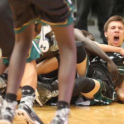 Nick Valles celebrates his last-second winning shot as Kearns High School defeats East High School 51-48 in the boy's 4A basketball tournament Monday, Feb. 29, 2016, in Orem.  