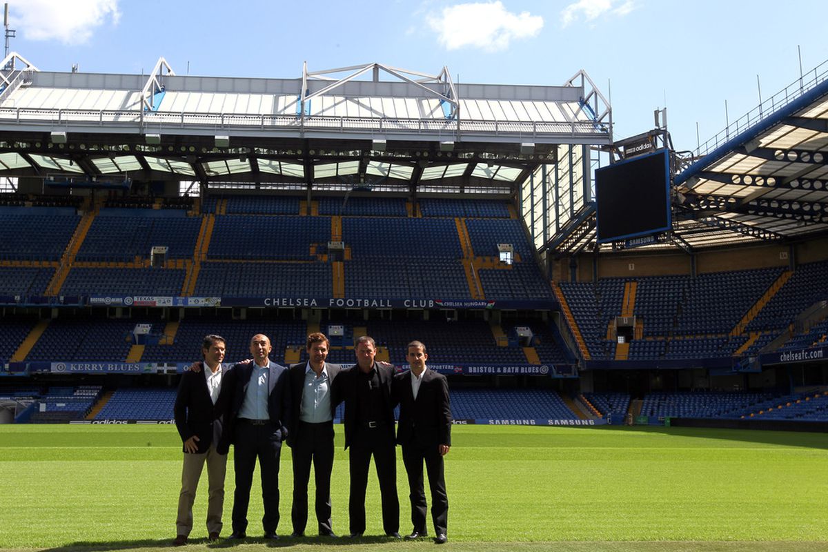 LONDON, ENGLAND - JUNE 29:  Andre Villas-Boas poses with his staff on the pitch after being unveiled as the new Chelsea Manager at Stamford Bridge on June 29, 2011 in London, England.  (Photo by Clive Rose/Getty Images)