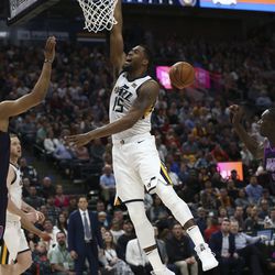 Utah Jazz forward Derrick Favors (15) shouts as he loses control of the ball while trying to score against the Minnesota Timberwolves at Vivint Arena in Salt Lake City on Thursday, March 14, 2019.