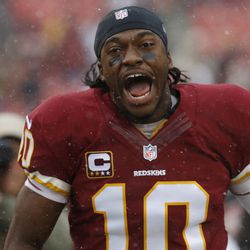 Washington Redskins quarterback Robert Griffin III (10) runs onto the field prior to the game against the Kansas City Chiefs at FedEx Field. 