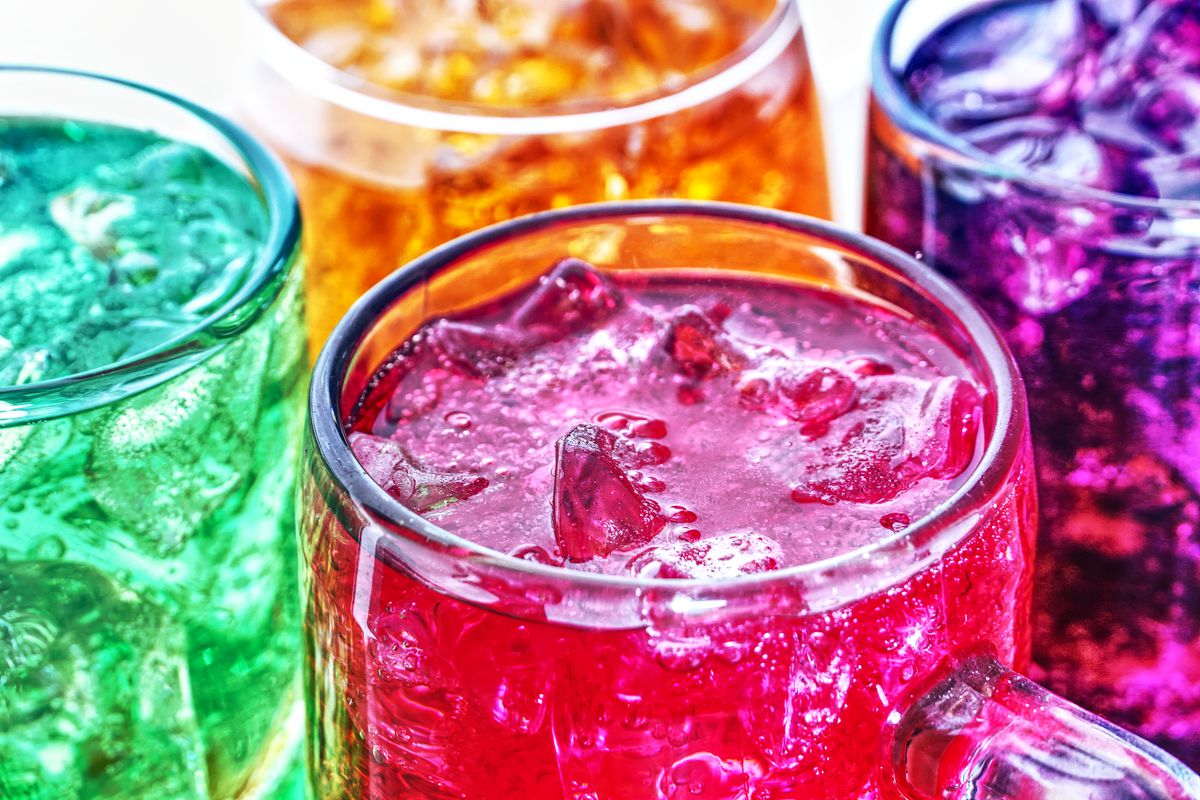 Pitchers holding jewel-colored beverages with ice