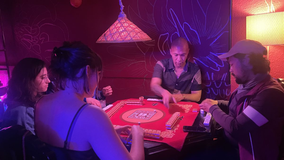 Four players seated around a mahjong table at Oakland’s Baba’s House