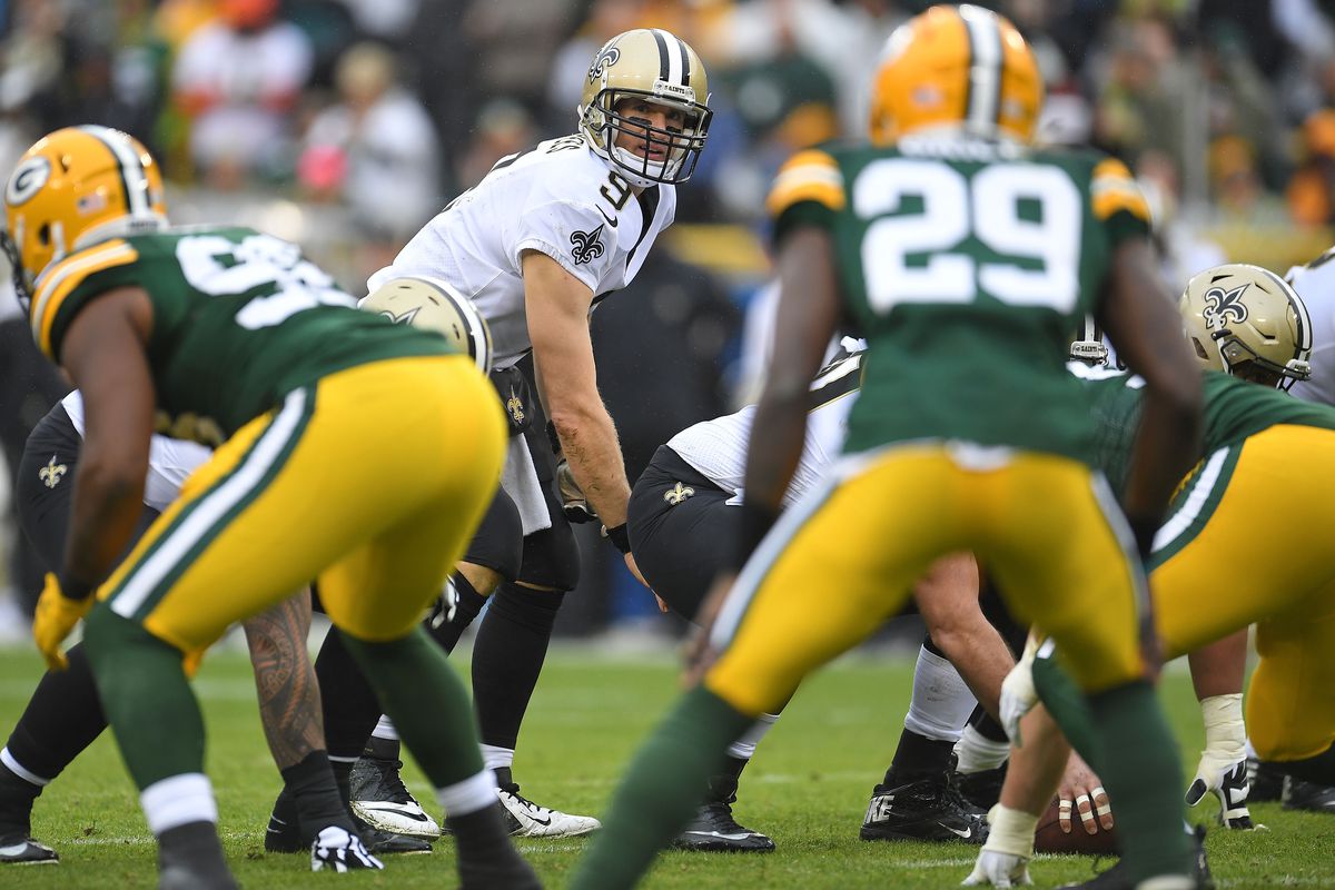 Drew Brees of the New Orleans Saints anticipates a snap during a game against the Green Bay Packers at Lambeau Field on October 22, 2017 in Green Bay, Wisconsin.