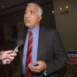 Salt Lake County District Attorney Sim Gill talks with members of the media as Democrats gather Tuesday, Nov. 4, 2014, in Salt Lake City. 