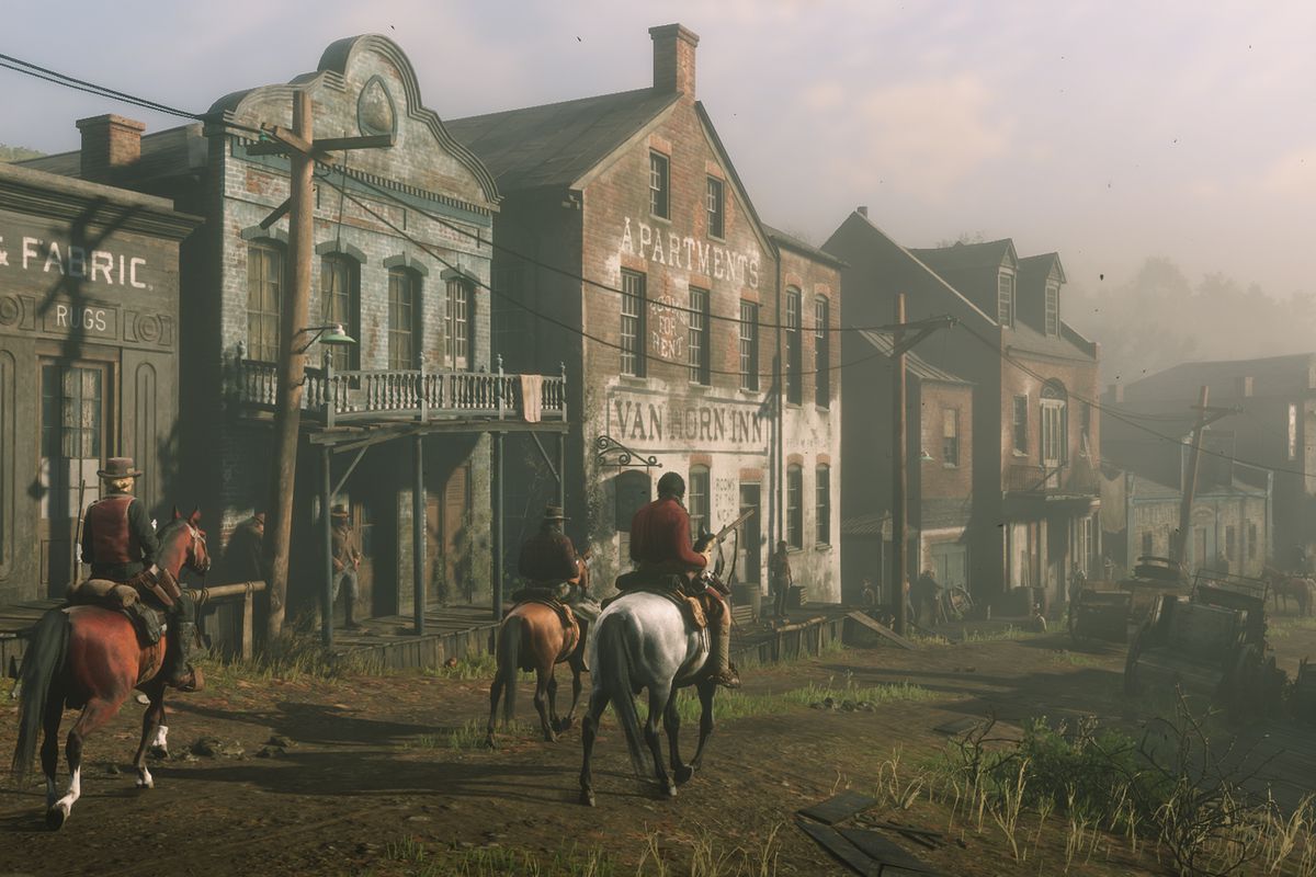 Red Dead Online - three people riding down the main drag of Van Horn Trading Post