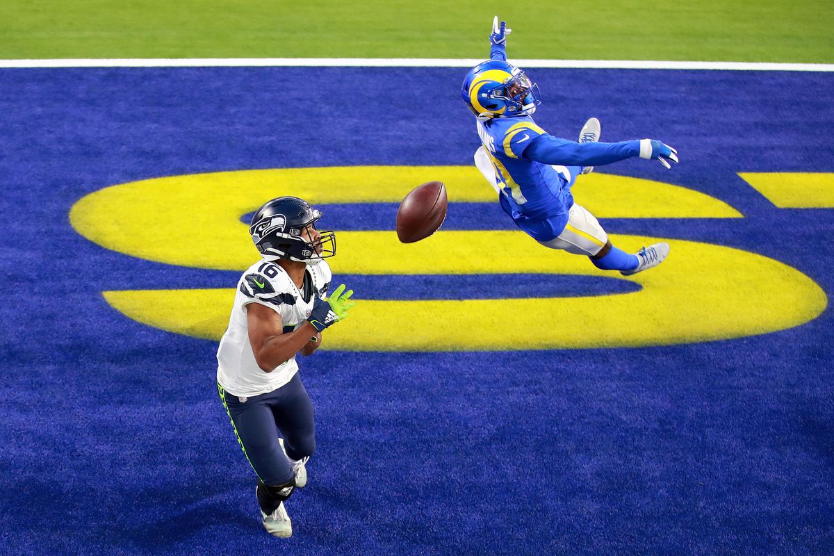 Tyler Lockett #16 of the Seattle Seahawks misses a catch in the end zone against Darious Williams #31 oif the Los Angeles Rams at SoFi Stadium on November 15, 2020 in Inglewood, California.
