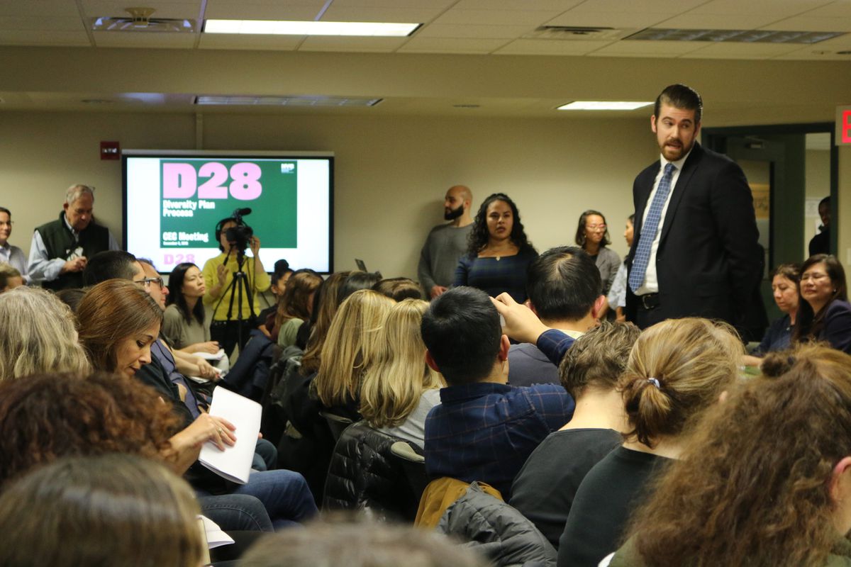 Education department officials took questions from parents regarding plans to integrate middle schools at a Community Education Council District 28 meeting in December 2019.