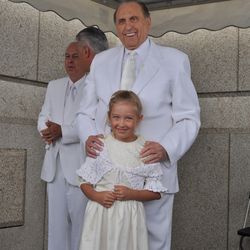 LDS Church President Thomas S. Monson stands with 8-year-old Sasha Maltoseva of Sakhalin, Russia, after she was invited among several children and others to apply mortar around the cornerstone of the Kyiv Ukraine Temple during the cornerstone ceremony at the Kyiv Ukraine Temple dedication services Sunday, Aug. 28, 2010, in Kiev, Ukraine.