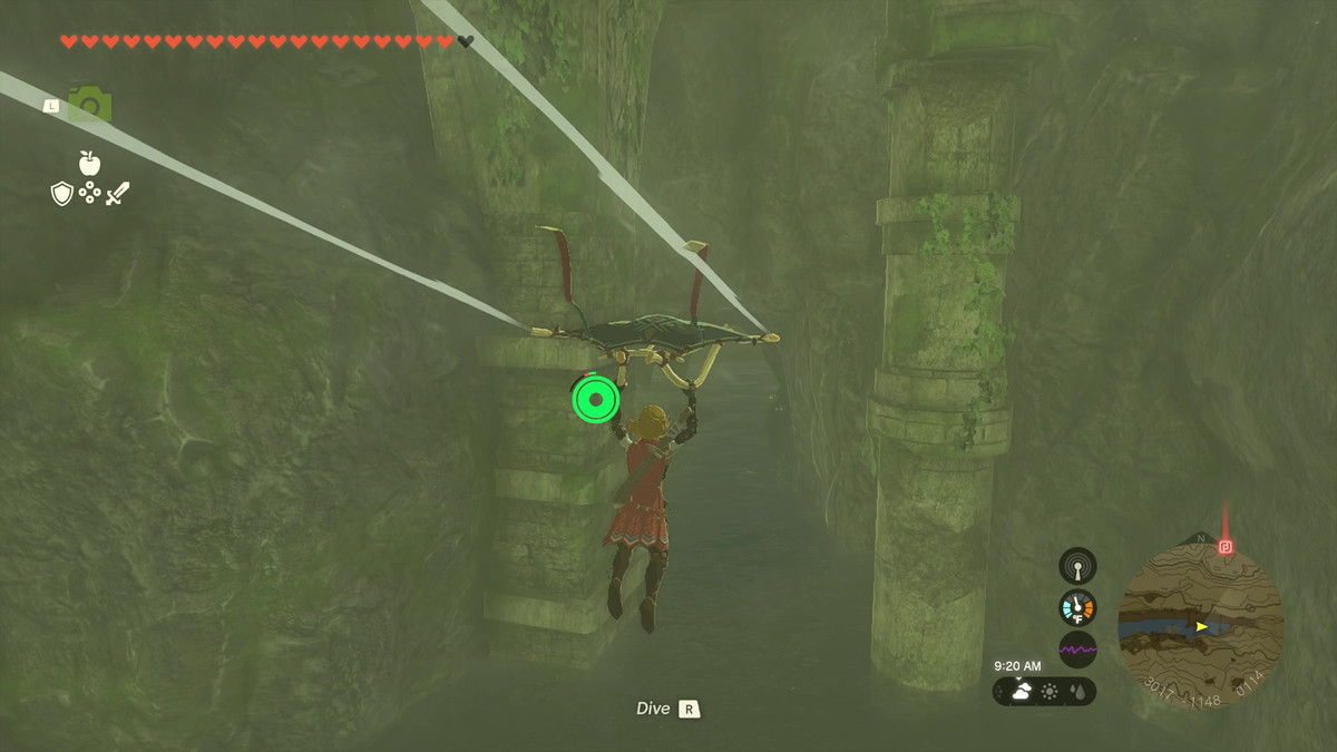 Link glides on his paraglider towards the entrance to the Lanayru Road East Cave, which is underneath a stone bridge