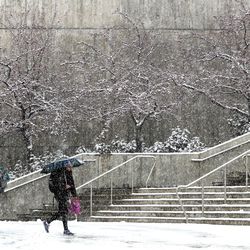 University of Utah students walk through the snow near the Marriott Library in Salt Lake City on Wednesday, Dec. 12, 2018.