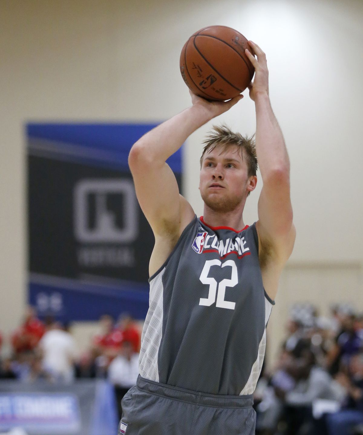 Eric Mika, from BYU, loosens up at the NBA draft basketball combine Thursday, May 11, 2017, in Chicago. (AP Photo/Charles Rex Arbogast)