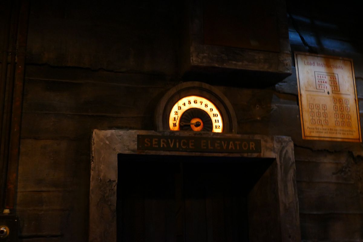 the floor indicator pointing to B for “basement” above a service elevator