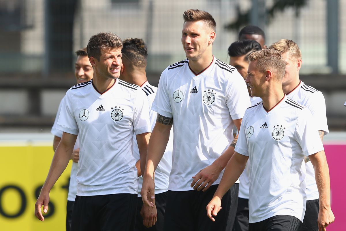 Thomas Mueller, Niklas Suele and Joshua Kimmich of Germany during a training session of the German National team at Robert-Schlienz-Stadion on August 30, 2017 in Stuttgart, Germany.