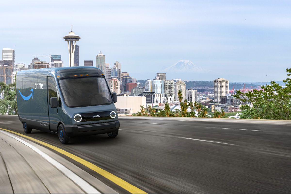 Rendering of van driving up a road. A view of densely clustered buildings is in the distance.