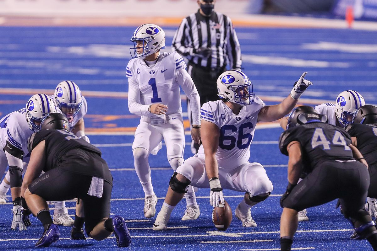 Quarterback Zach Wilson and offensive lineman James Empey of the BYU Cougars both call out signals during second half action against the Boise State Broncos at Albertsons Stadium on November 6, 2020 in Boise, Idaho. BYU won the game 51-17.