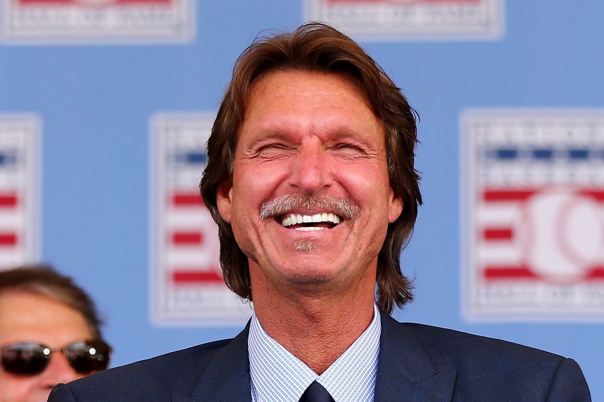 Randy Johnson smiles as Pedro Martinez speaks during the Hall of Fame Induction Ceremony at National Baseball Hall of Fame on July 26, 2015 in Cooperstown, New York.