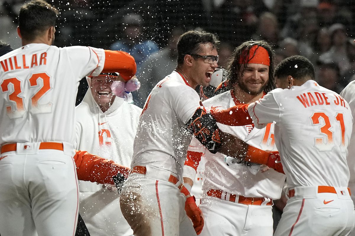 Blake Sabol celebrates with his teammates after a walk-off home run