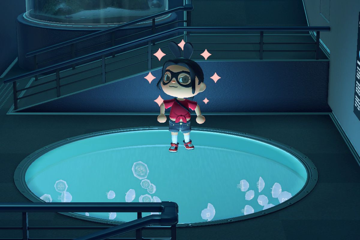 An Animal Crossing character stands proudly over a tank of jellyfish