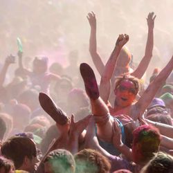 People crowd surf at the Holi Festival of Colors at the Krishna Temple in Spanish Fork on Saturday, March 30, 2013. 
