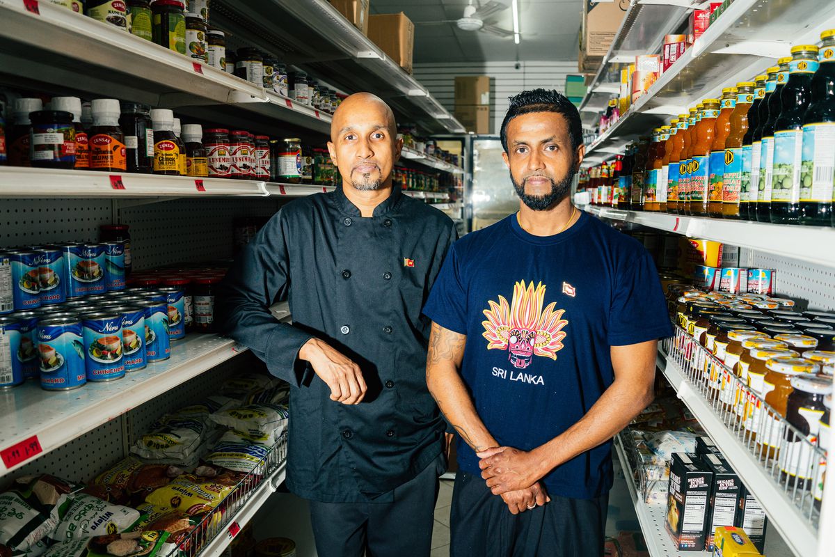 Two men, Rasika Wetthasinghe and Suchira Wijayarathne, stand in the aisle of a grocery store.