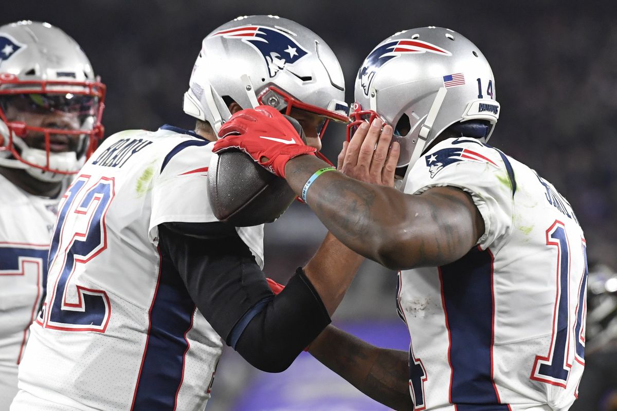New England Patriots wide receiver Mohamed Sanu celebrates his touchdown with quarterback Tom Brady during the second quarter against the Baltimore Ravens at M&amp;T Bank Stadium.