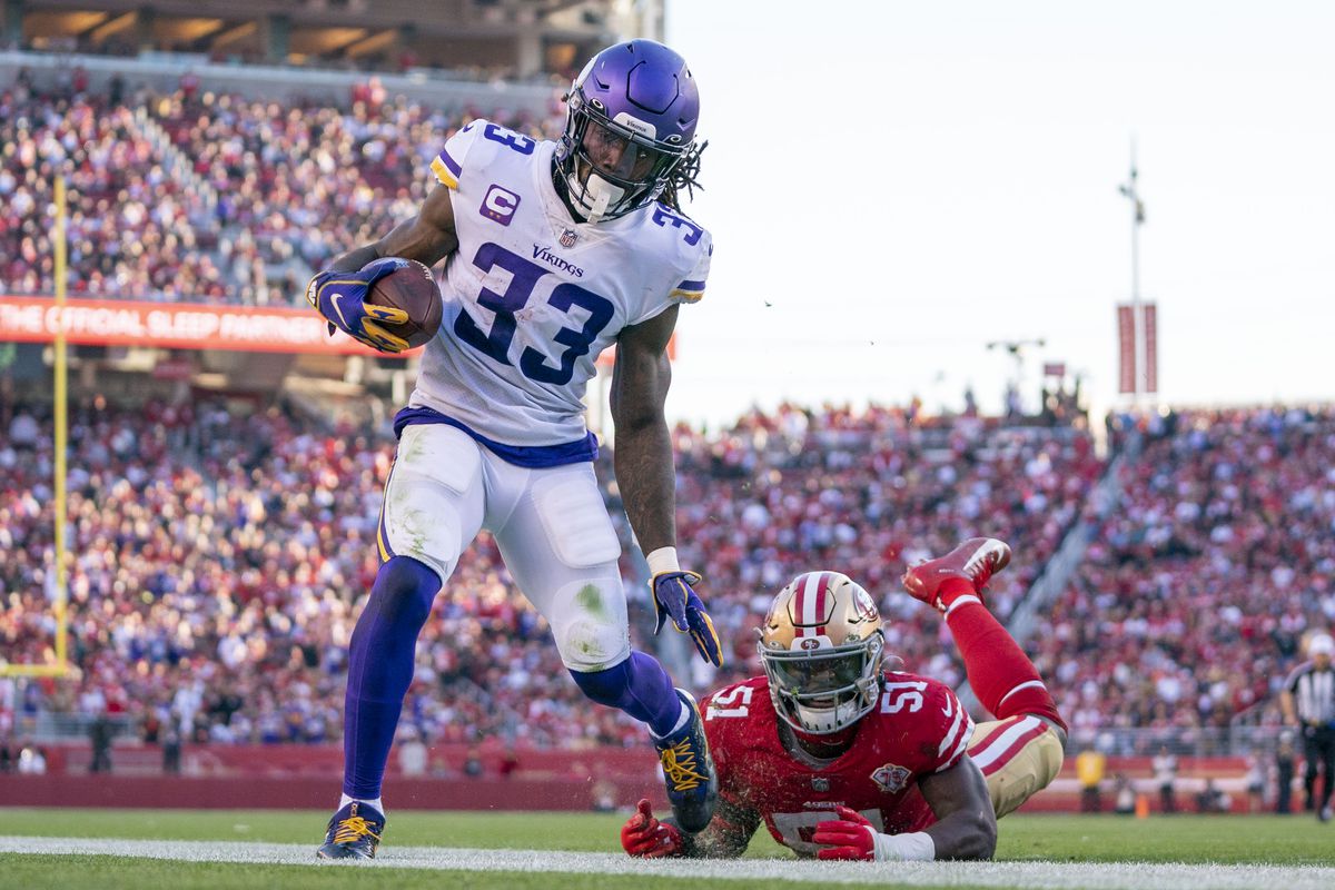 Minnesota Vikings running back Dalvin Cook (33) is pushed out of bounds by San Francisco 49ers outside linebacker Azeez Al-Shaair (51) during the third quarter at Levi’s Stadium.
