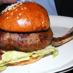 [The Bone-in Burger from M. Wells Steakhouse. By <a href="http://www.flickr.com/photos/37619222@N04/10863459976/in/pool-eater">The Food Doc</a>.]