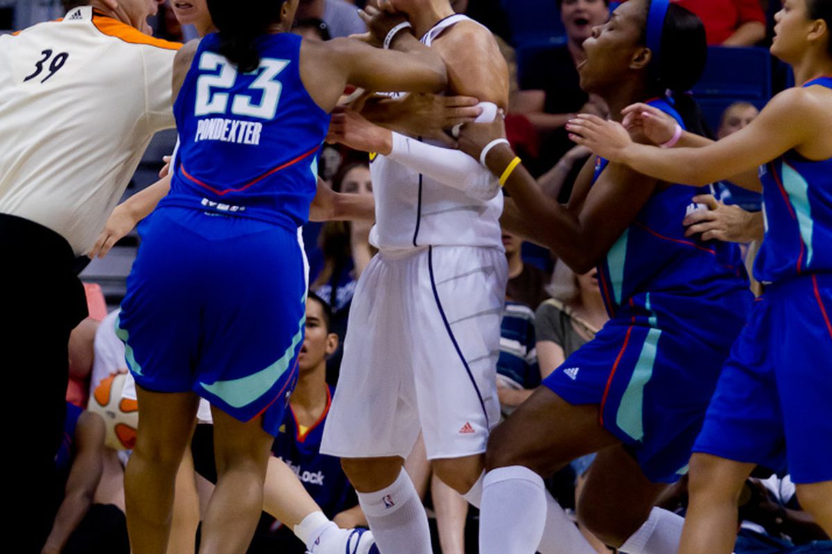 Former teammates and best friends, Cappie Pondexter and Diana Taurasi mix it up in Phoenix, Just one of three incidents to occur in the WNBA on Saturday Fight Night (Photo by Ryan Malone)