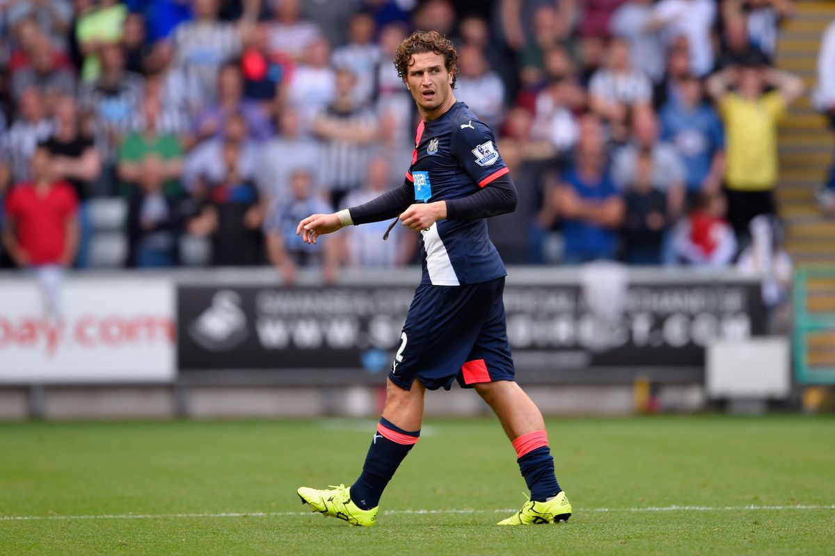 Darryl Janmaat leaves the field after being shown a second yellow card. Newcastle were already struggling before this and Janmaat's dismissal just made it worse.