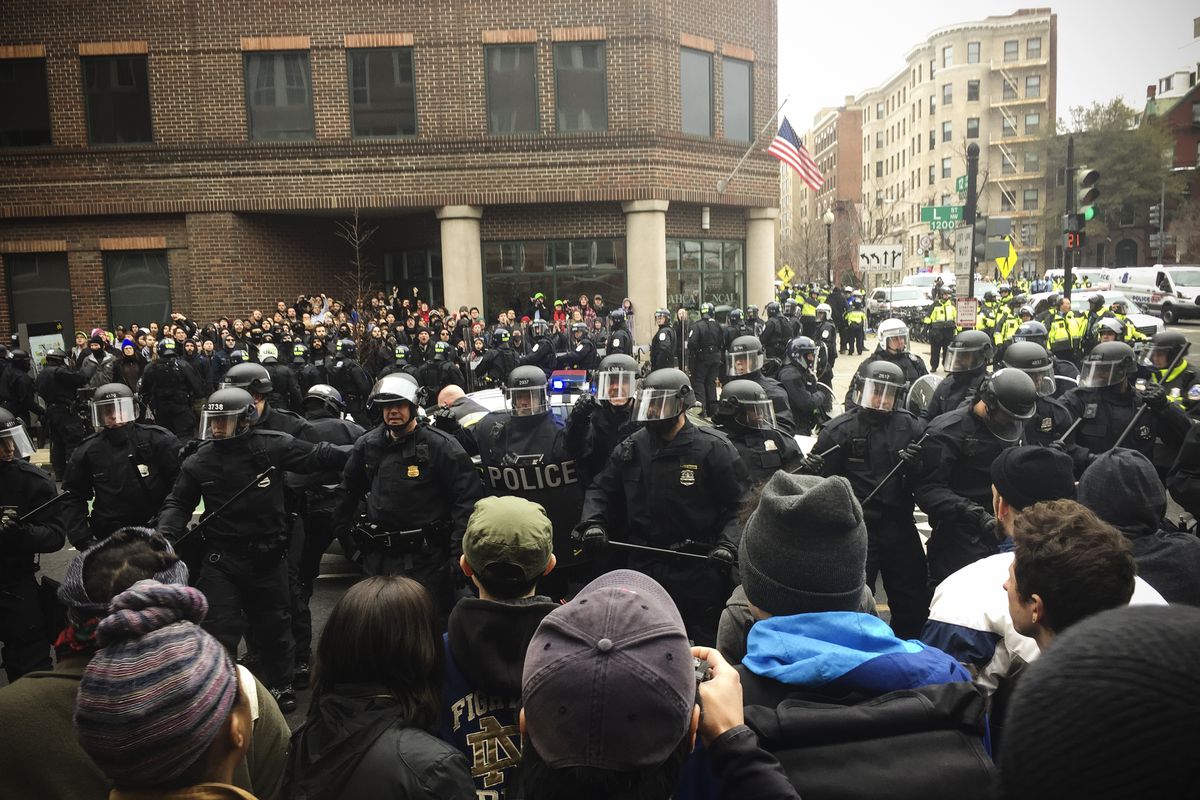 Protestors ringed off by a wall of police during Trump’s Inauguration