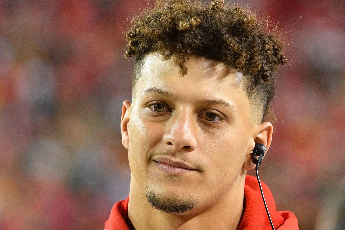 Kansas City Chiefs quarterback Patrick Mahomes watches play from the sidelines during the first half against the Green Bay Packers at Arrowhead Stadium.
